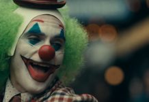 Joaquin Phoenix laughing as Joker in Joker Movie