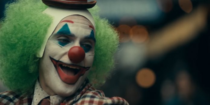 Joaquin Phoenix laughing as Joker in Joker Movie